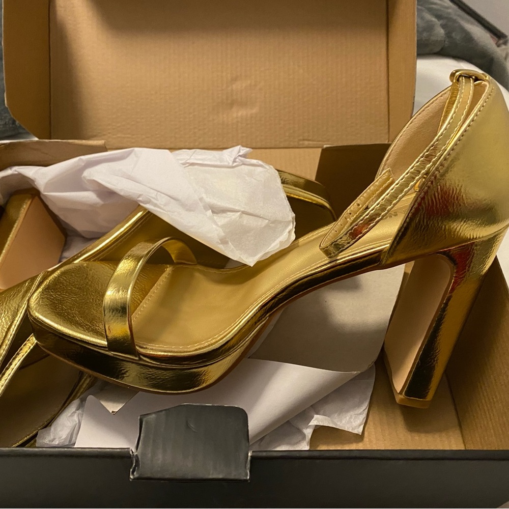 Shiny gold heels